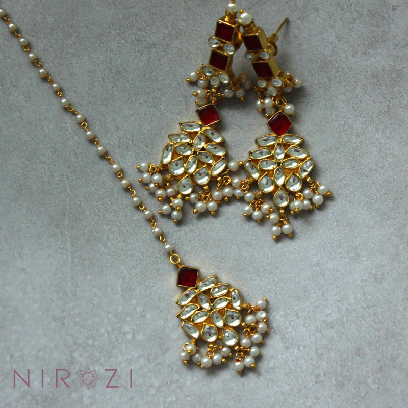 Earring and tikka set is brass based with stones set in silver foil and 18kt gold plated. The perfect piece to add to your collection of Kundan jewelry. Beautifully handcrafted and made to last you a lifetime. Beautiful Ruby color set.