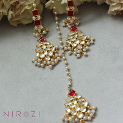 Earring and tikka set is brass based with stones set in silver foil and 18kt gold plated. The perfect piece to add to your collection of Kundan jewelry. Beautifully handcrafted and made to last you a lifetime. Beautiful Ruby color set. 